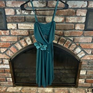 Green Lyrical Dress with Floral Accent